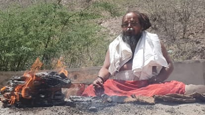 Amidst the scorching heat in Barmer baba is doing sadhna with a burning pot on his head middle of fire