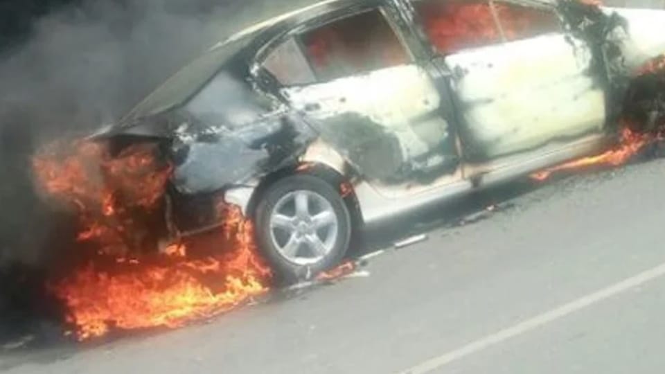 Fire broke out in a car parked in a police station parking lot as soon as it started