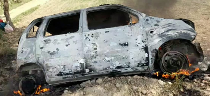 Car catches fire after hitting an electric pole