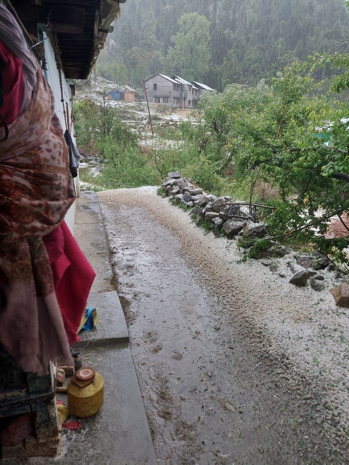 Heavy hailstorm on the mountains, dust storm in the plains