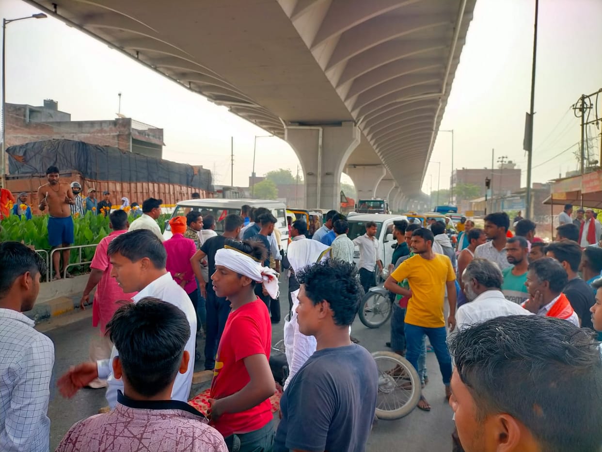 Road accident in varanasi Bike rider woman dies after being hit by truck her son life narrowly saved