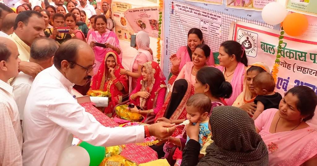 In the health fair, the MP made the babies happy