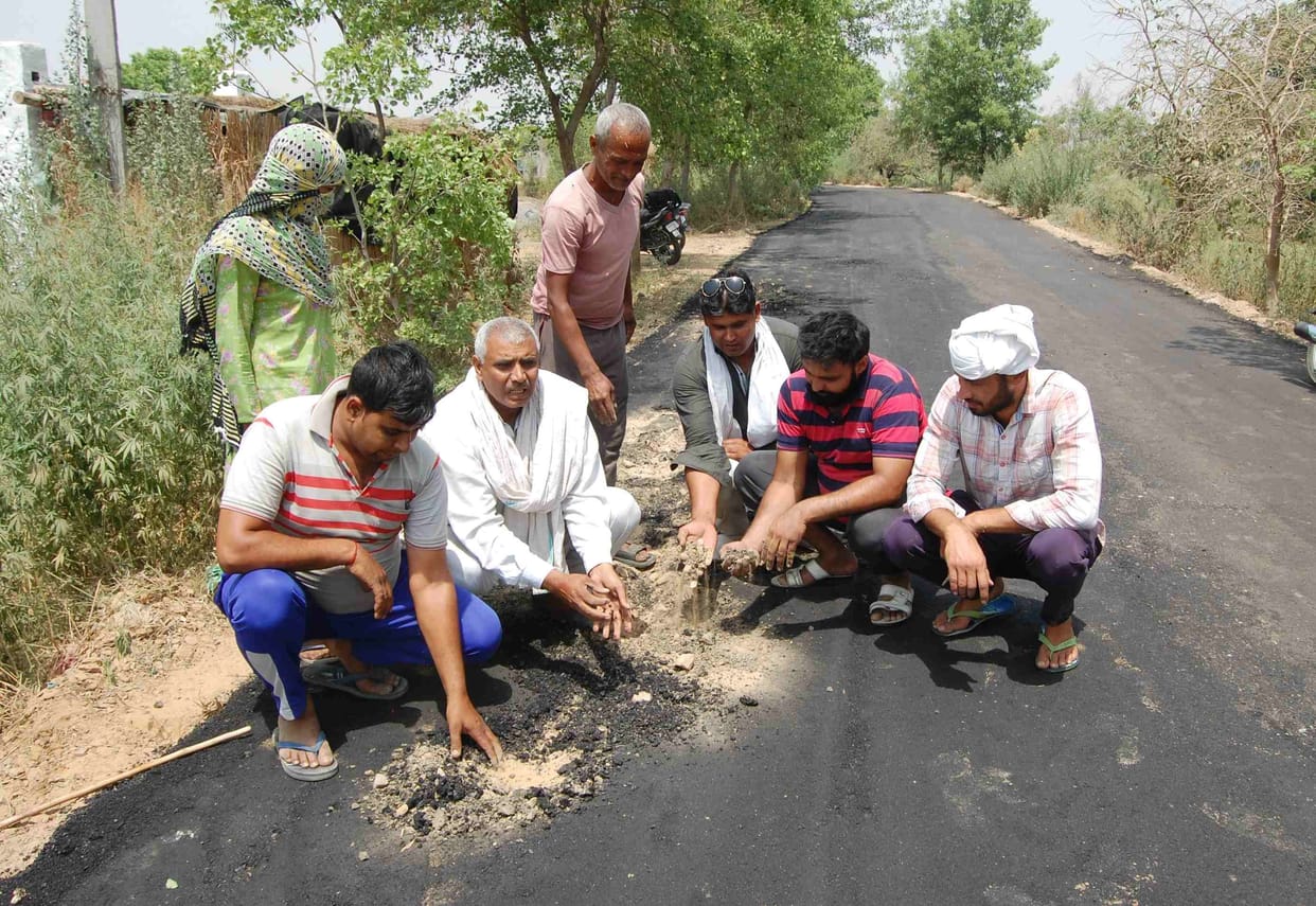 Pradhan Mantri Gram Sadak Yojana: Road made by laying coal tar and gravel on the soil