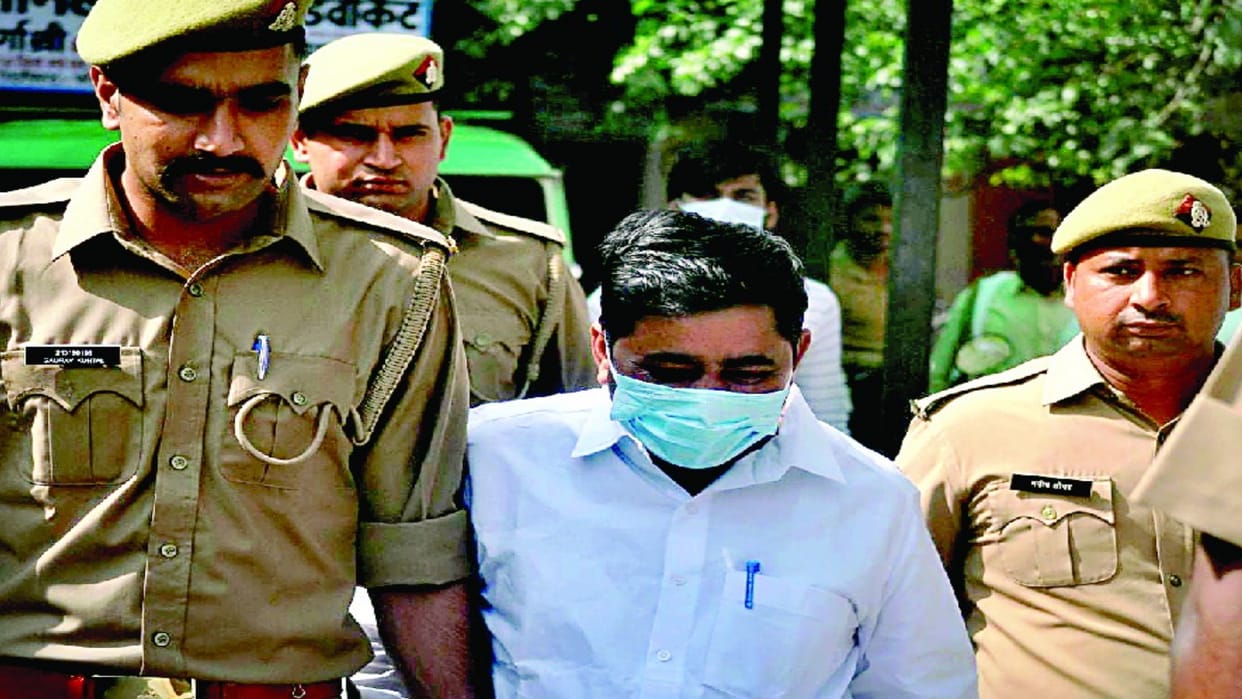 Former SP district president arrested accused of hurting religious sentiments SPs staged a sit-in