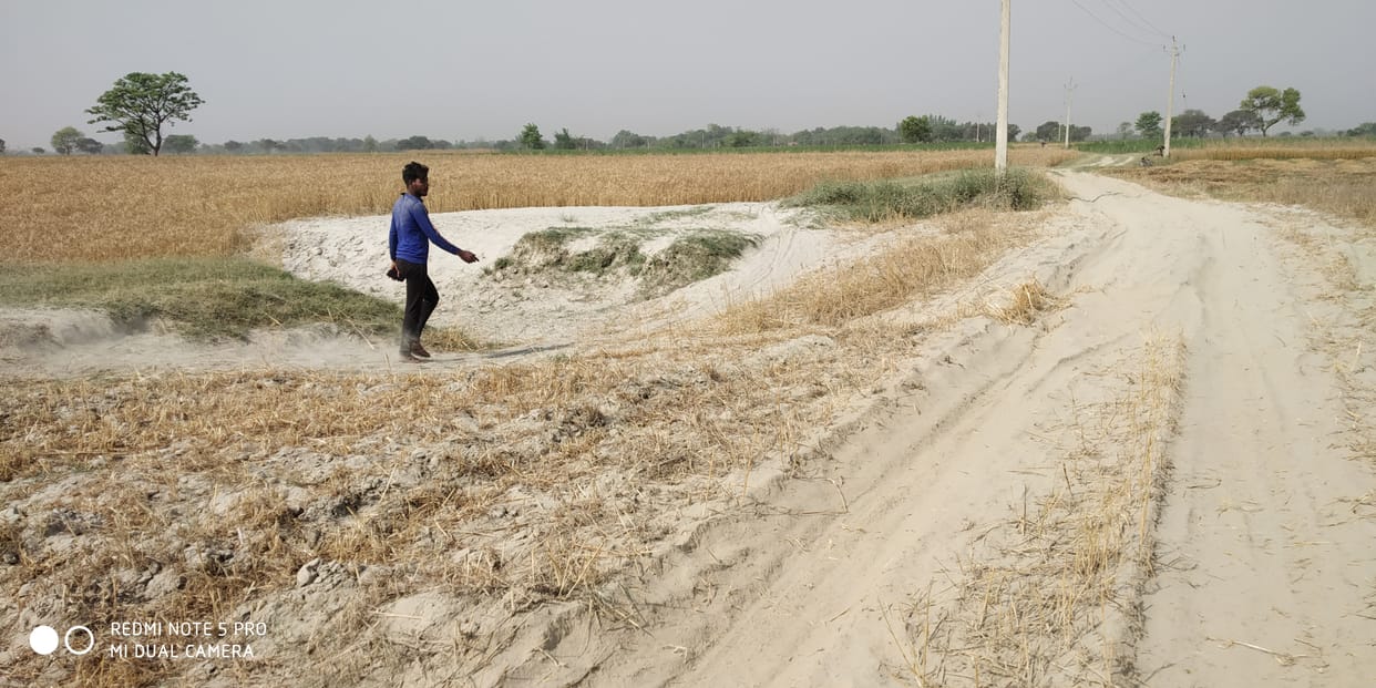 Flood damaged approach road waiting to be repaired