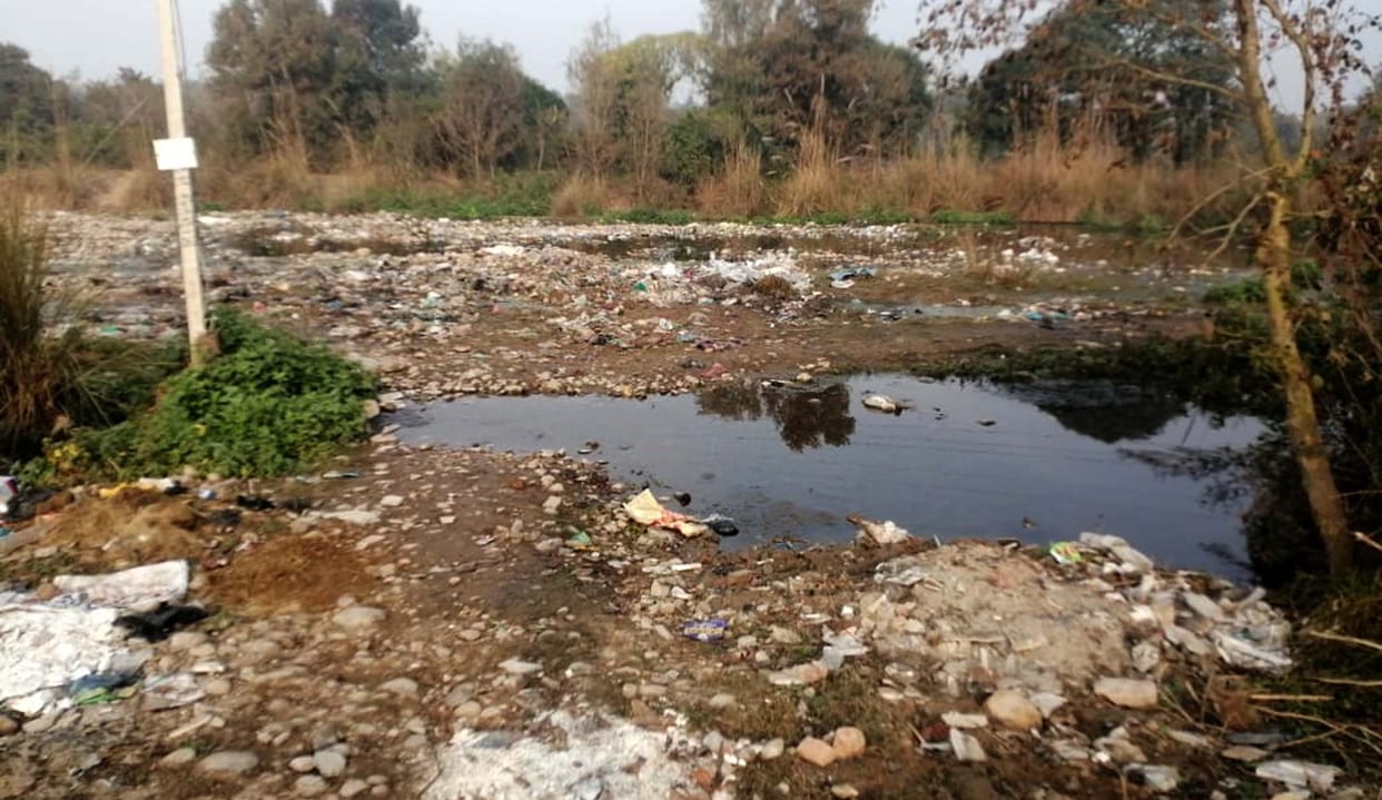 Garbage being thrown on the banks of the drain, water getting contaminated