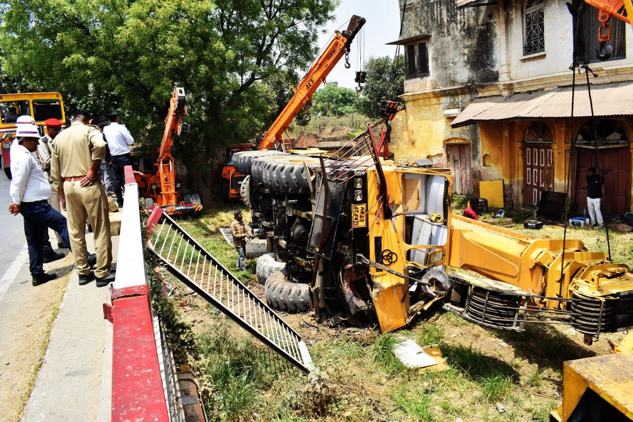 Crane fell under the bridge to save the bus