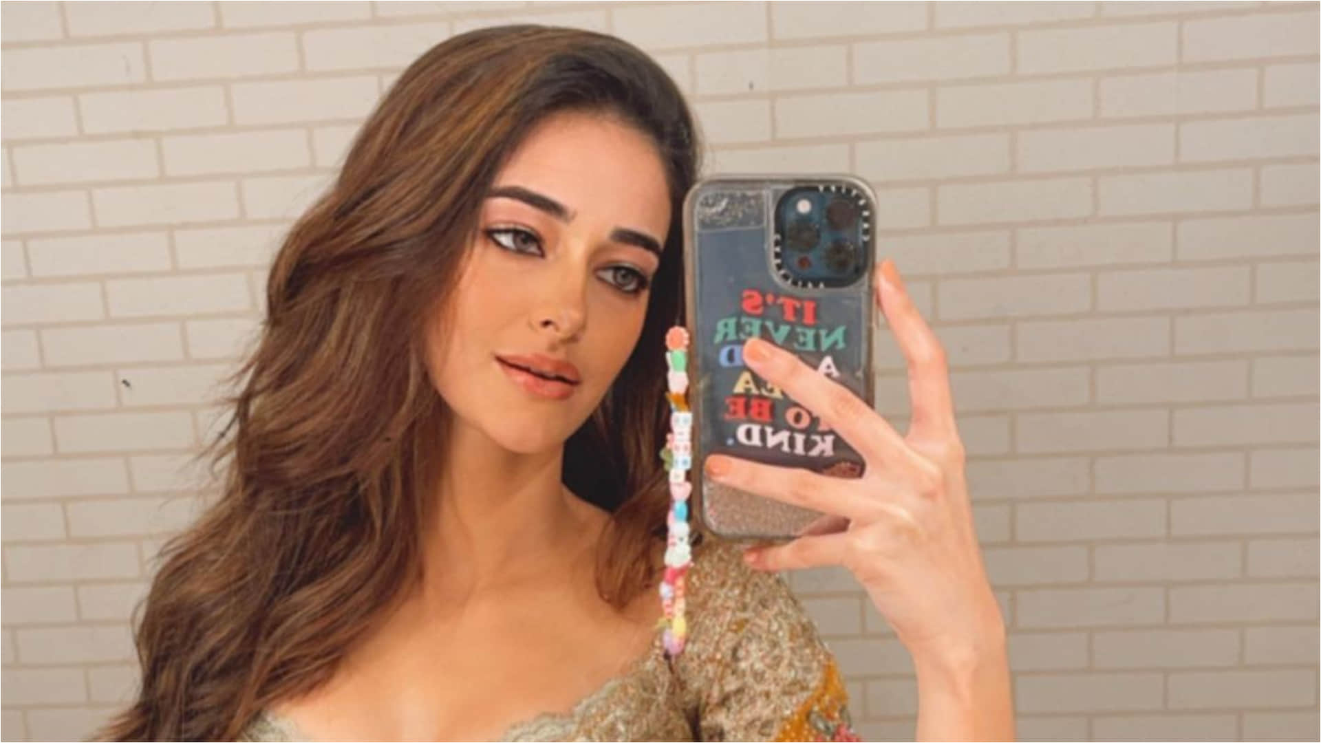 ananya pandey taking mirror selfie flaunts slim waist in mustard lehenga