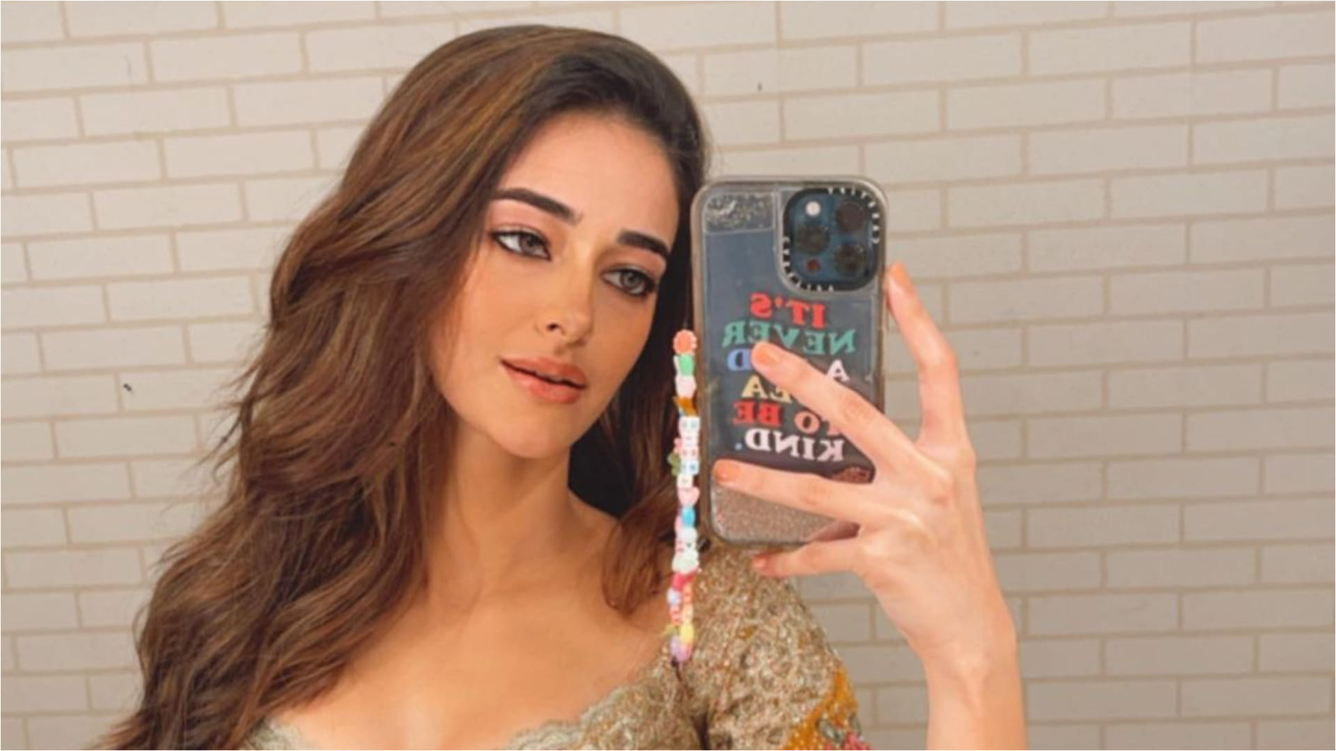 ananya pandey taking mirror selfie flaunts slim waist in mustard lehenga