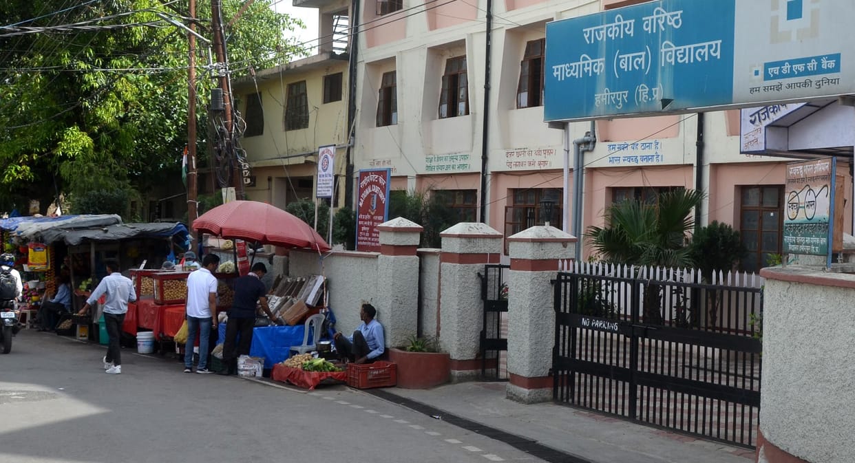 Study inside school premises, noise of vegetable vendors outside