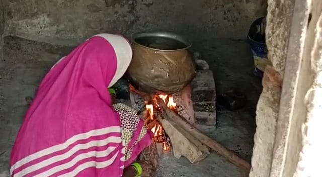 Mid-day meal being made on wood stove in school