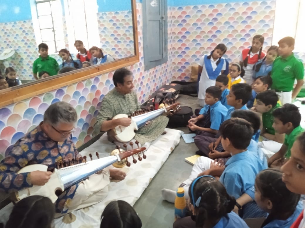students learn to play sarod