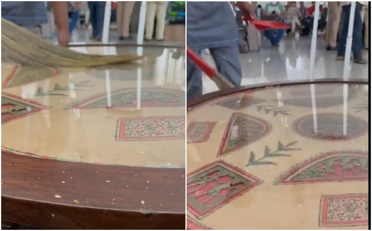 sweeper cleaned table with broom at varanasi airport suspended after video went viral