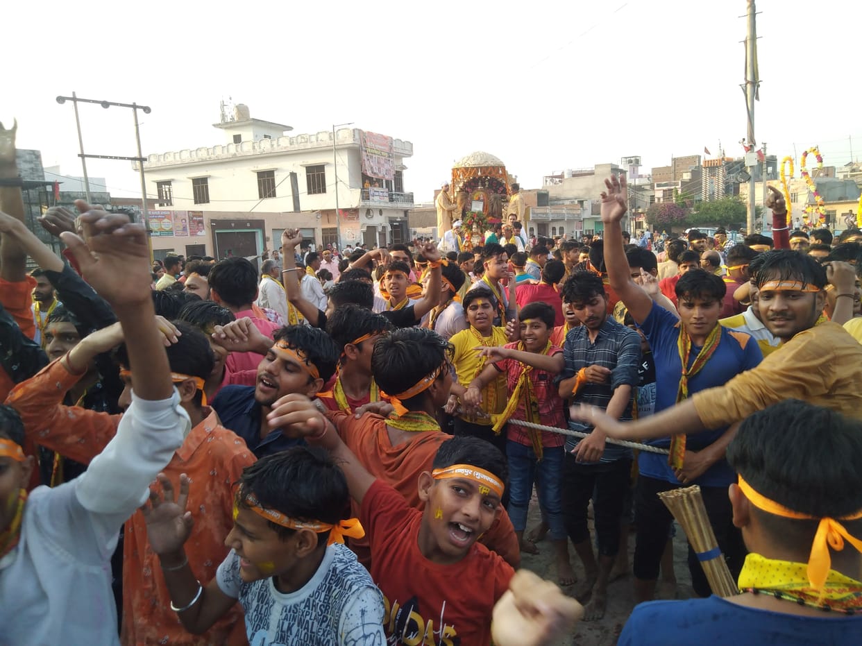 Devotees pulled the chariot barefoot, welcomed by flower showers