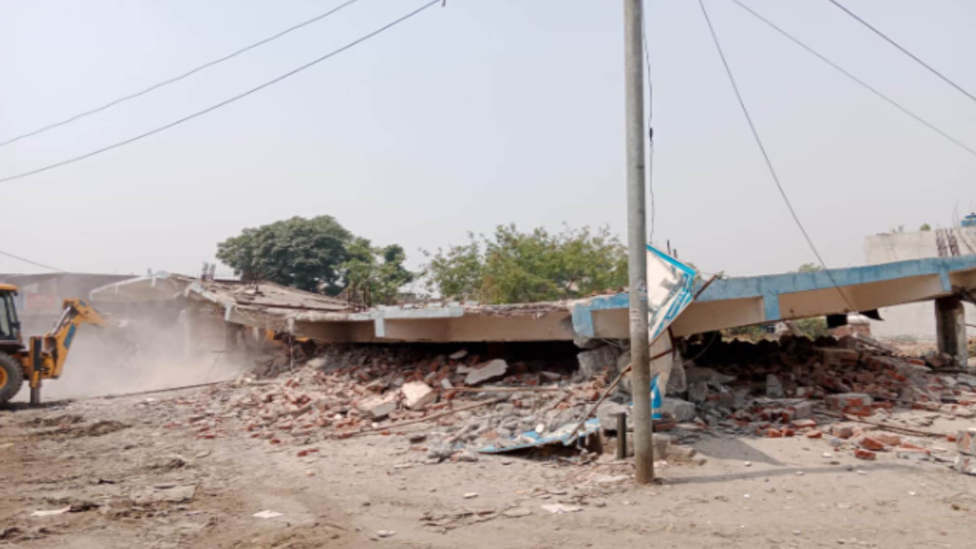 UP News: seven shops of Ajay Sehgal were demolished by bulldozed by the administration in Meerut see photos