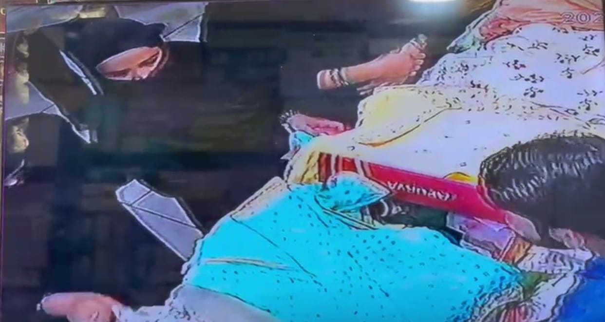 Women wearing burqa stole two lehengas