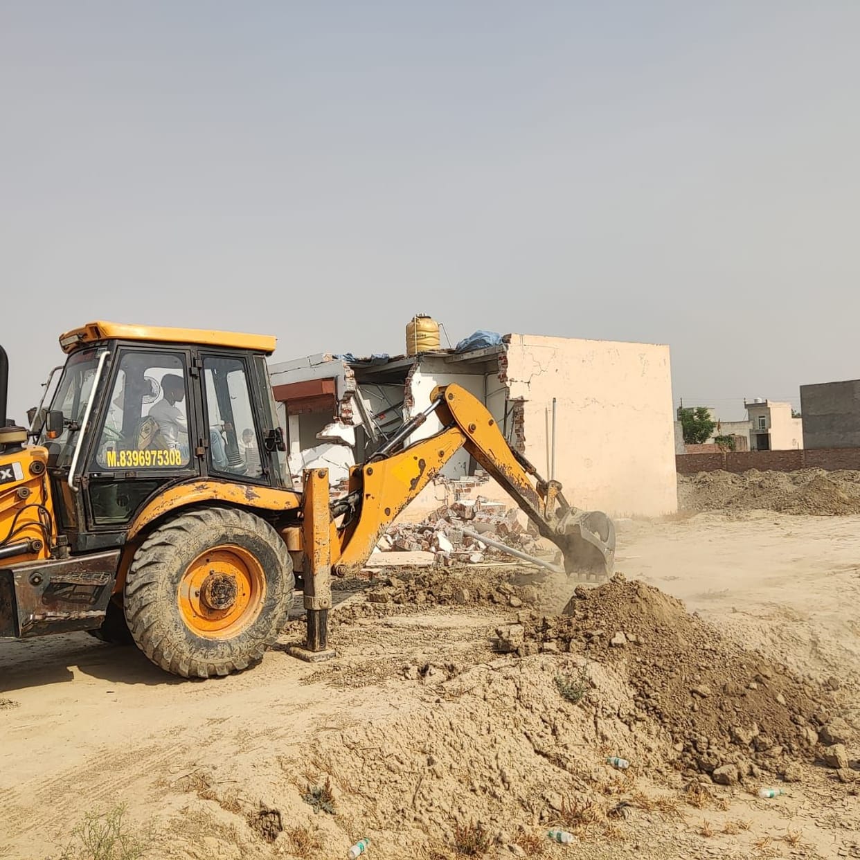 Road demolished, foundation uprooted, house demolished