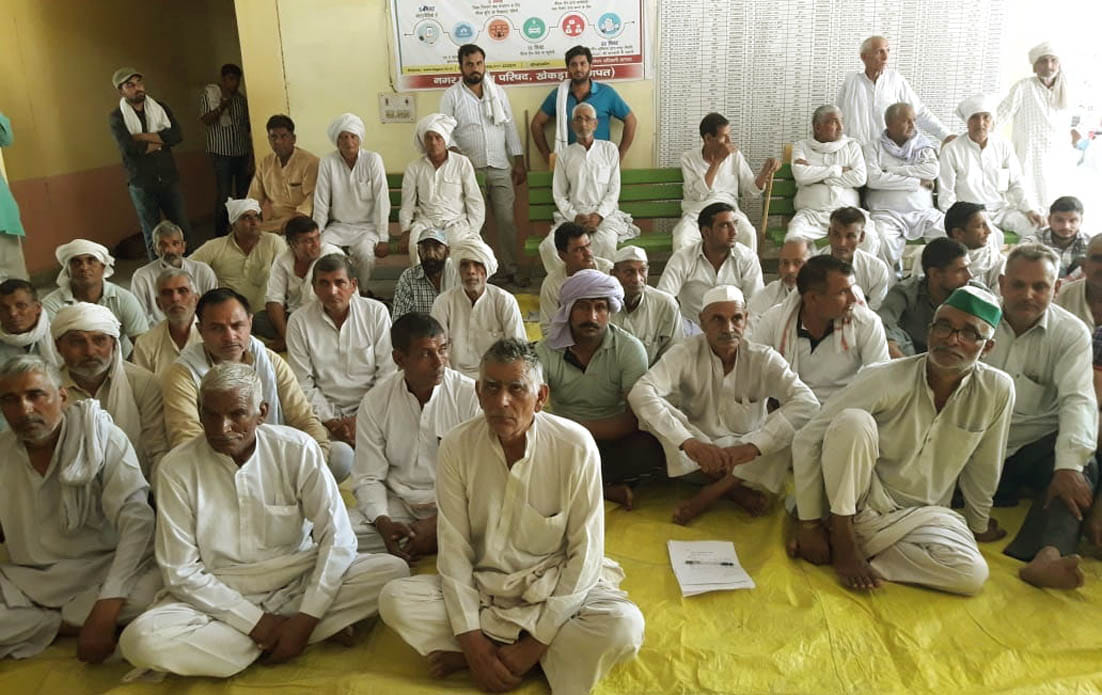 In protest against the survey of government land, farmers staged a sit-in in the tehsil