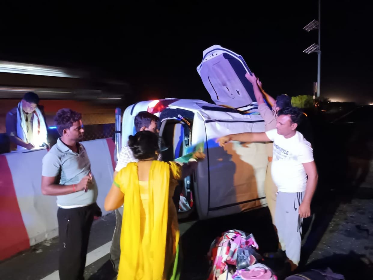 The car overturned after hitting the divider, seven injured