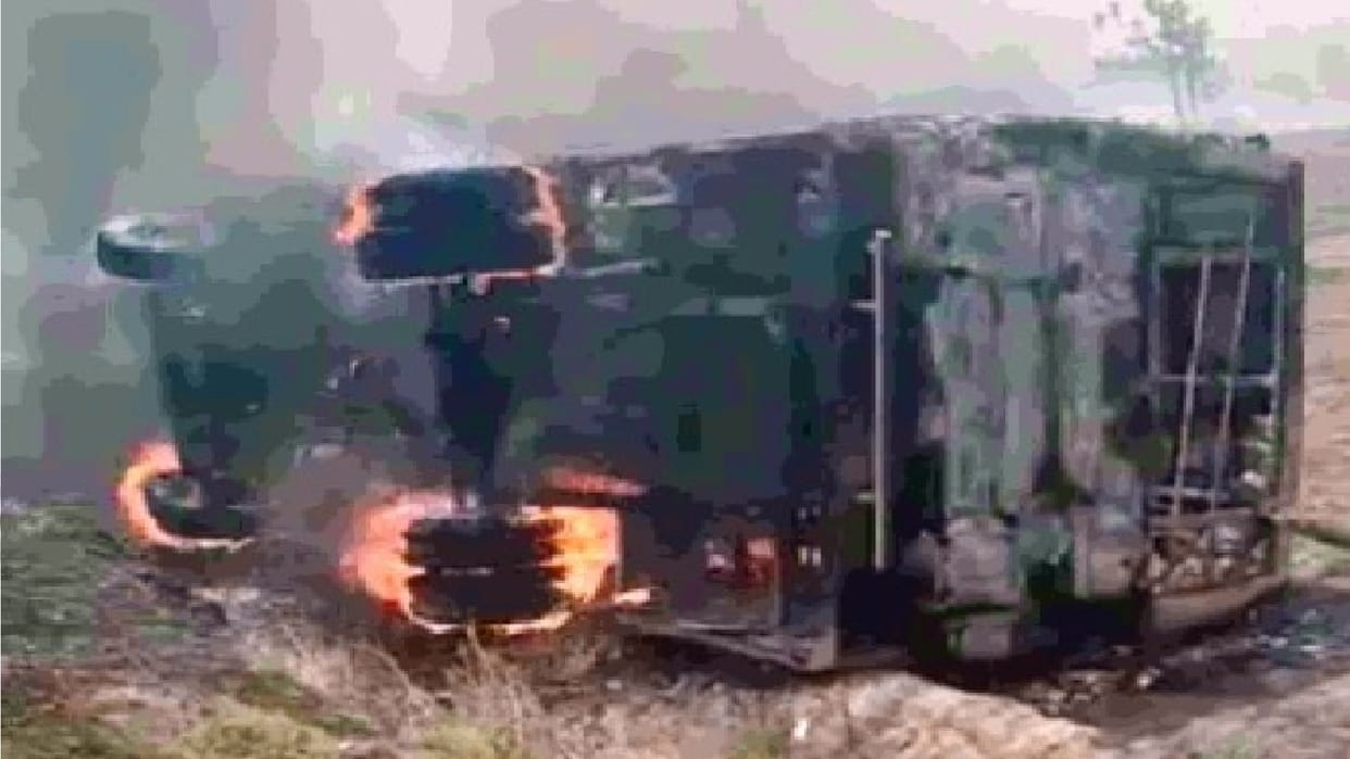 private school bus overturned due to smoke from fire in field