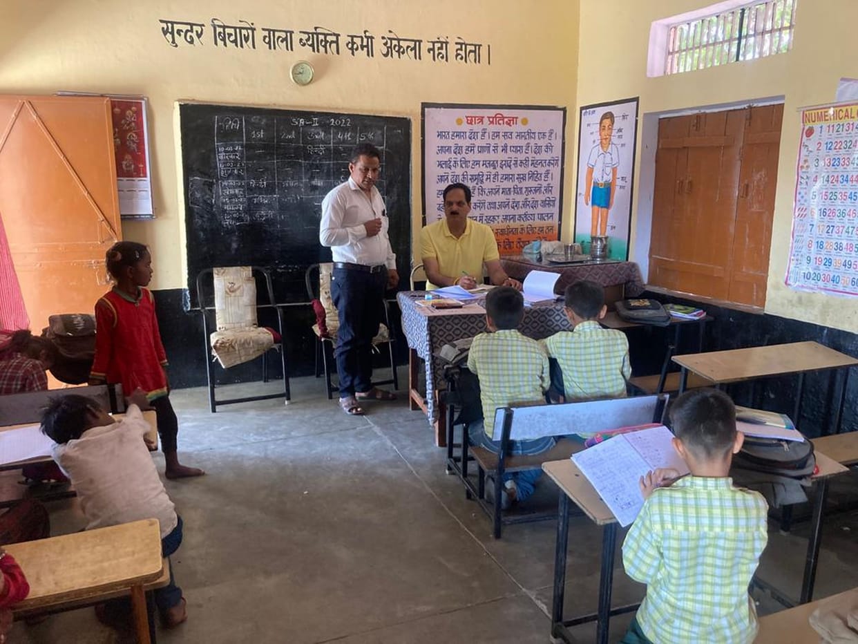 Deputy Director inspected the schools and checked the reading material
