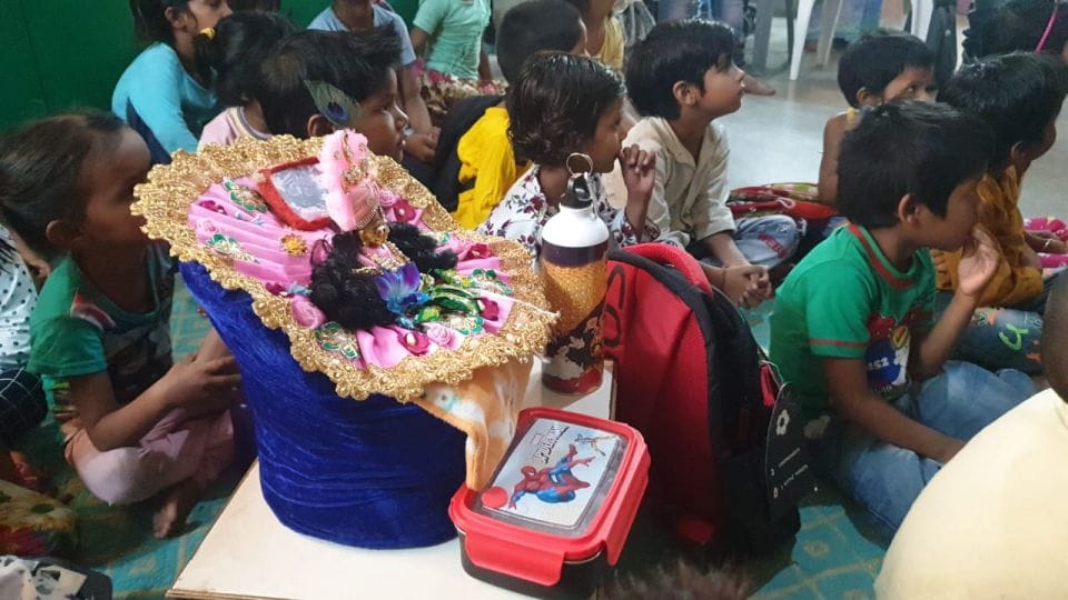 Lord Shri Krishna studying with children in Mathura school