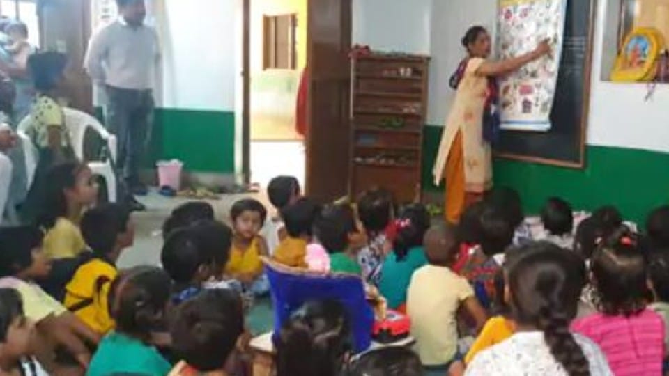Lord Shri Krishna studying with children in Mathura school