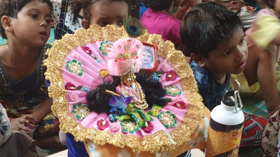 Lord Shri Krishna studying with children in Mathura school