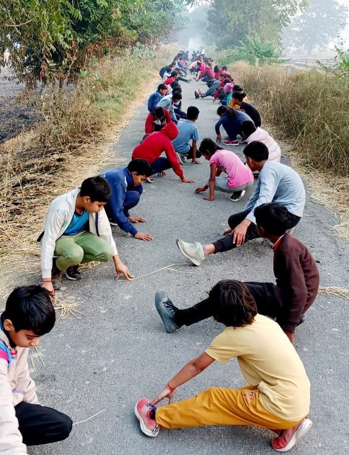 Athletes getting ready by practicing on the paths of the fields