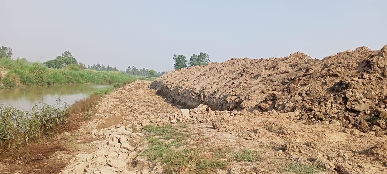 10 meter wide embankment being constructed in Malan river