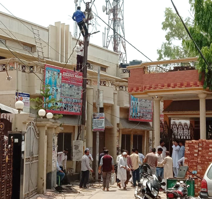Electricity meters installed on poles amid protests