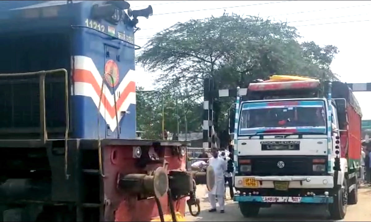 Truck standing on the track, suddenly the train came, the truck driver jumped and ran