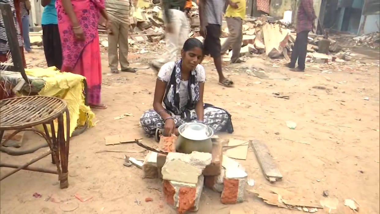 woman started to cook on streets after her house was demolished in anti-encroachment drive in Chennai