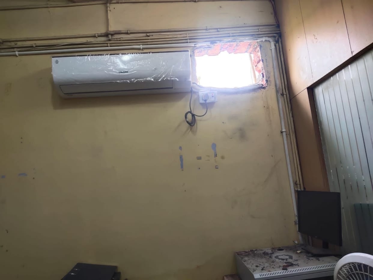 The thief entered the bank wearing a mask, searched the cupboard