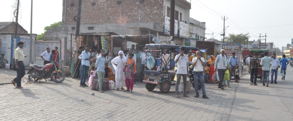 Passengers waiting for buses on Agra Aligarh route