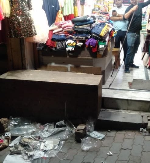 Businessmen caught throwing garbage on the side of the road at night