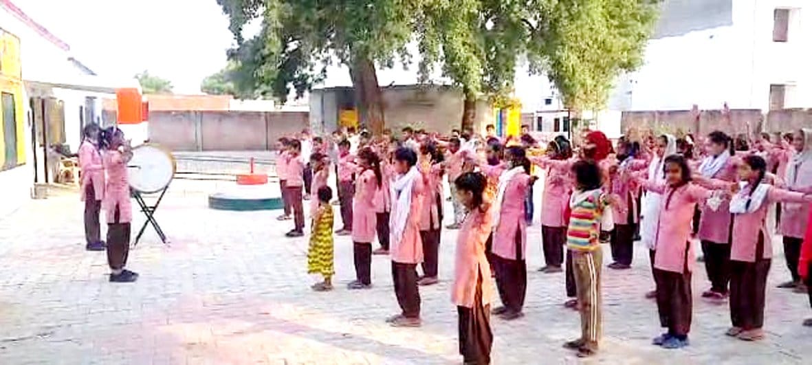 Children pray themselves after reaching school before teachers