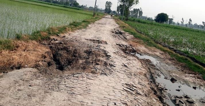 Villagers upset due to potholes in the road