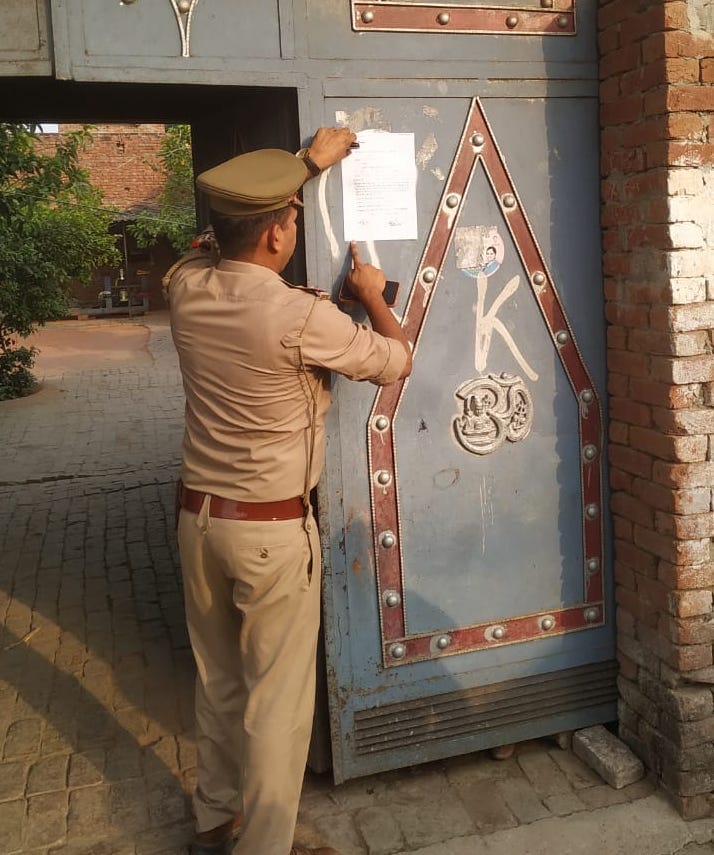 Attachment notice pasted at the house of accused two brothers