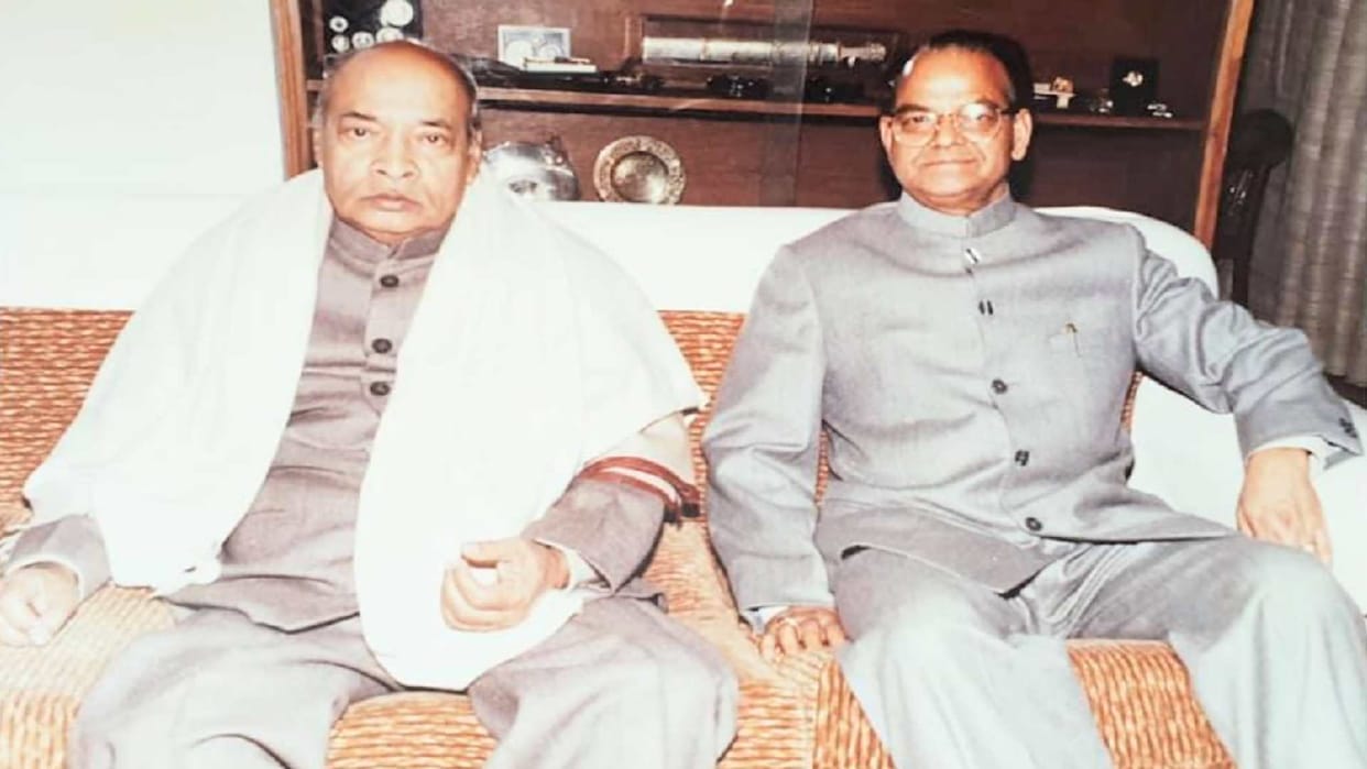 pandit Sukhram was the minister who delivered the landline from door to door and received the first call on mobile