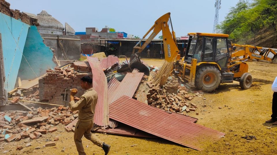 Bulldozer demolished illegally built factory and dairy on government land in Jalesar Etah