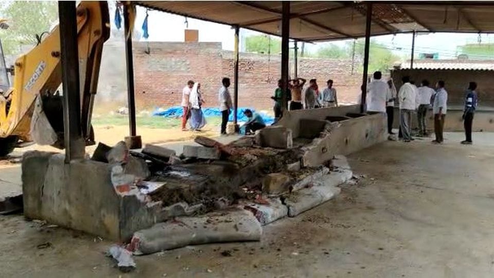Bulldozer demolished illegally built factory and dairy on government land in Jalesar Etah