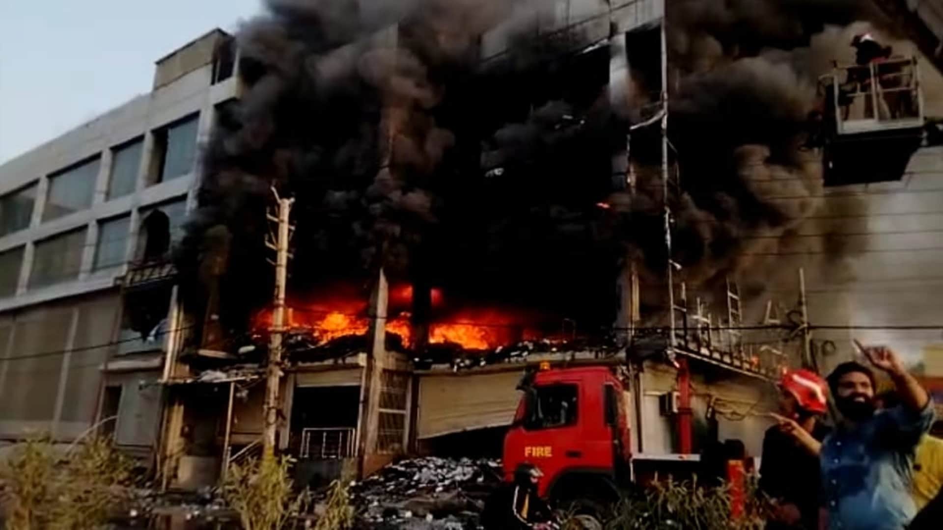 Delhi Mundka Fire woman said that if she had not jumped out by breaking glass she would have been burnt to ashes