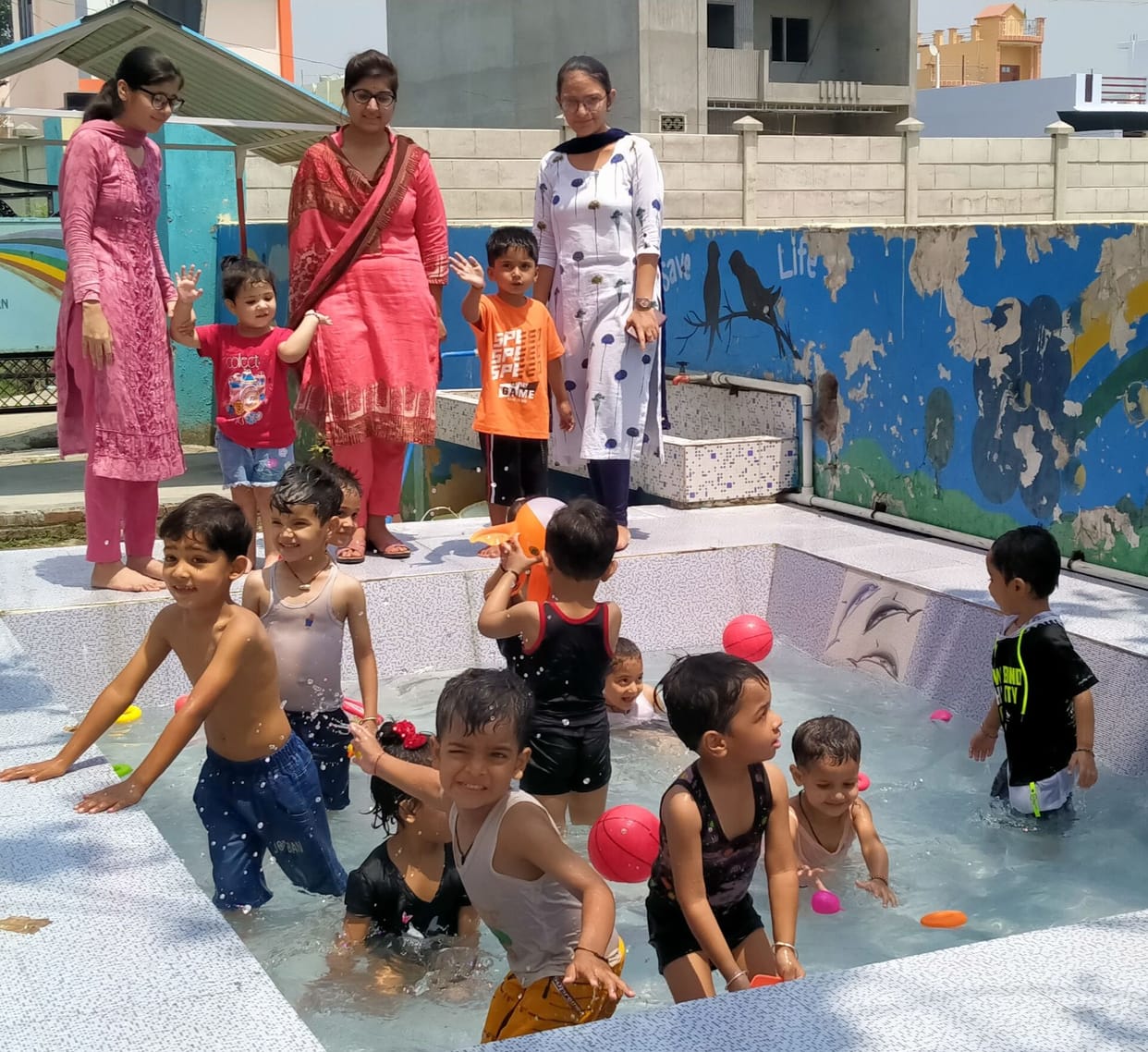 children swimming in the swimming pool