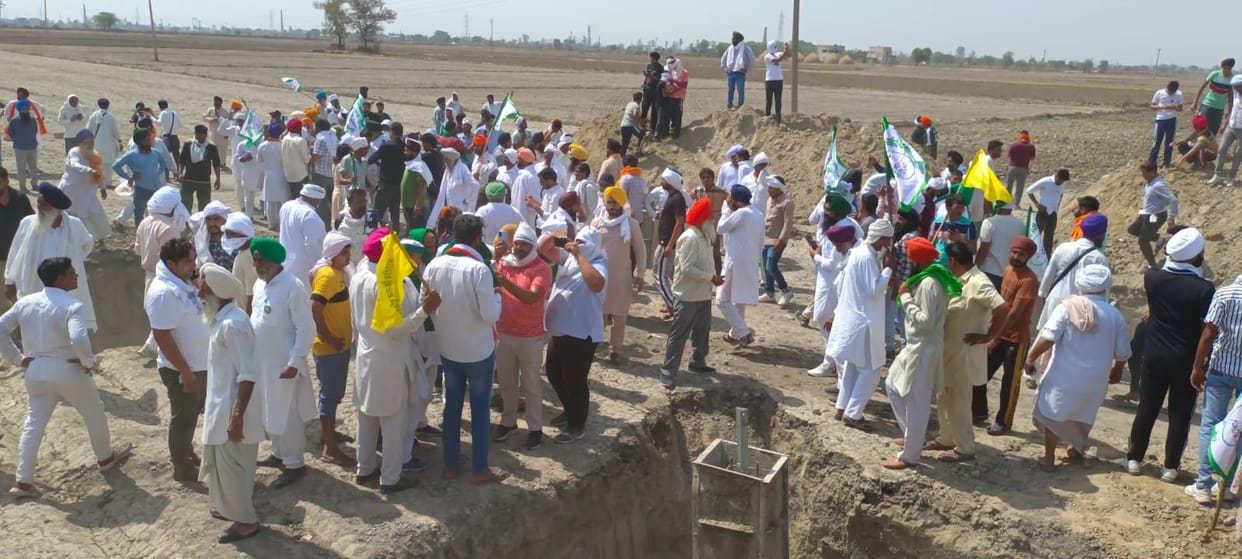 Angry farmers filled the soil in the pits of the tower line