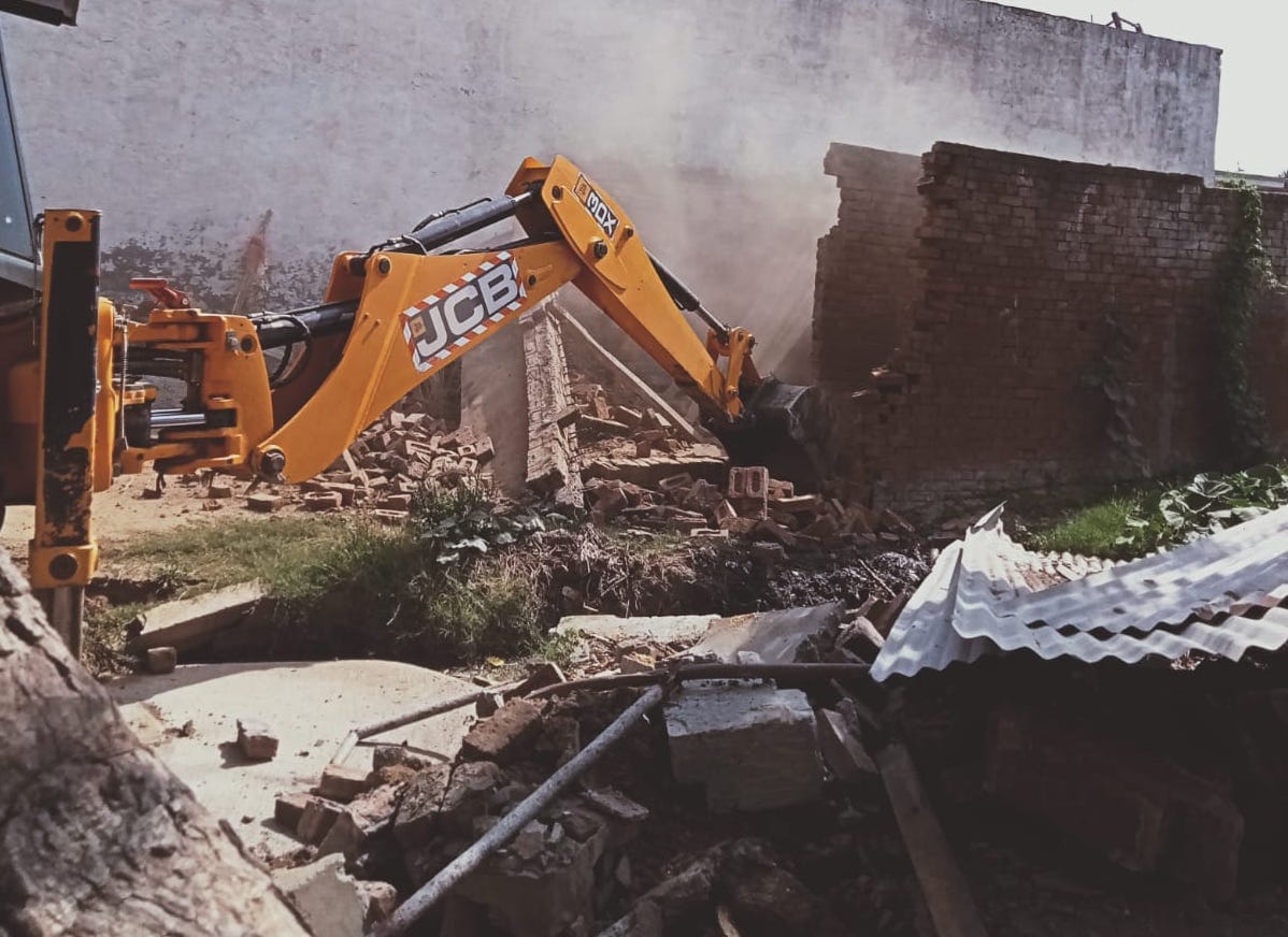 Bulldozer ran on the land of the pond in Jharkhedi