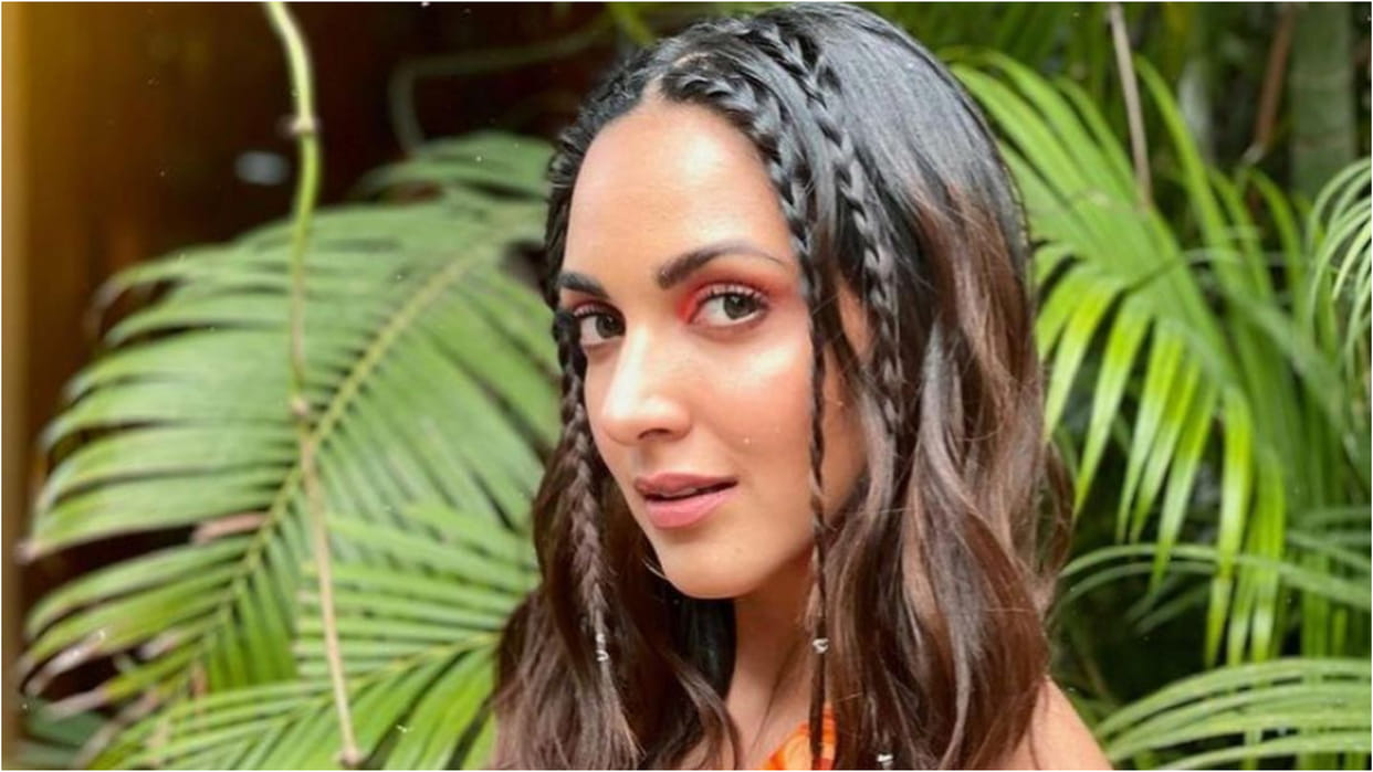 kiara advani orange halter neck backless dress with multi braid perfect for summer look