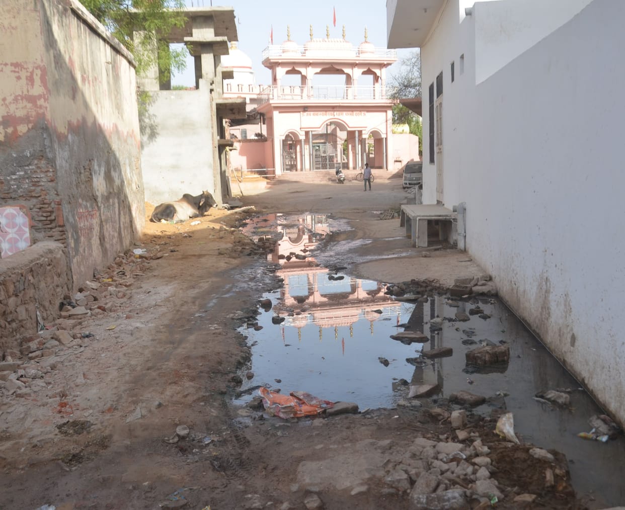 Contaminated water filled with sewer overflow in front of the temple, people raised slogans against the department