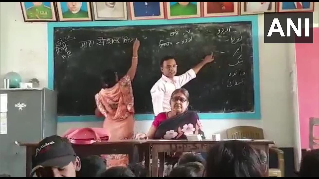 Hindi and Urdu being taught on same blackboard in one classroom of school in Katihar