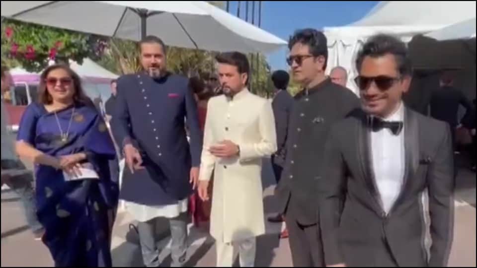 Deepika Padukone wearing a black and golden sari on the red carpet of Cannes Film Festival 2022